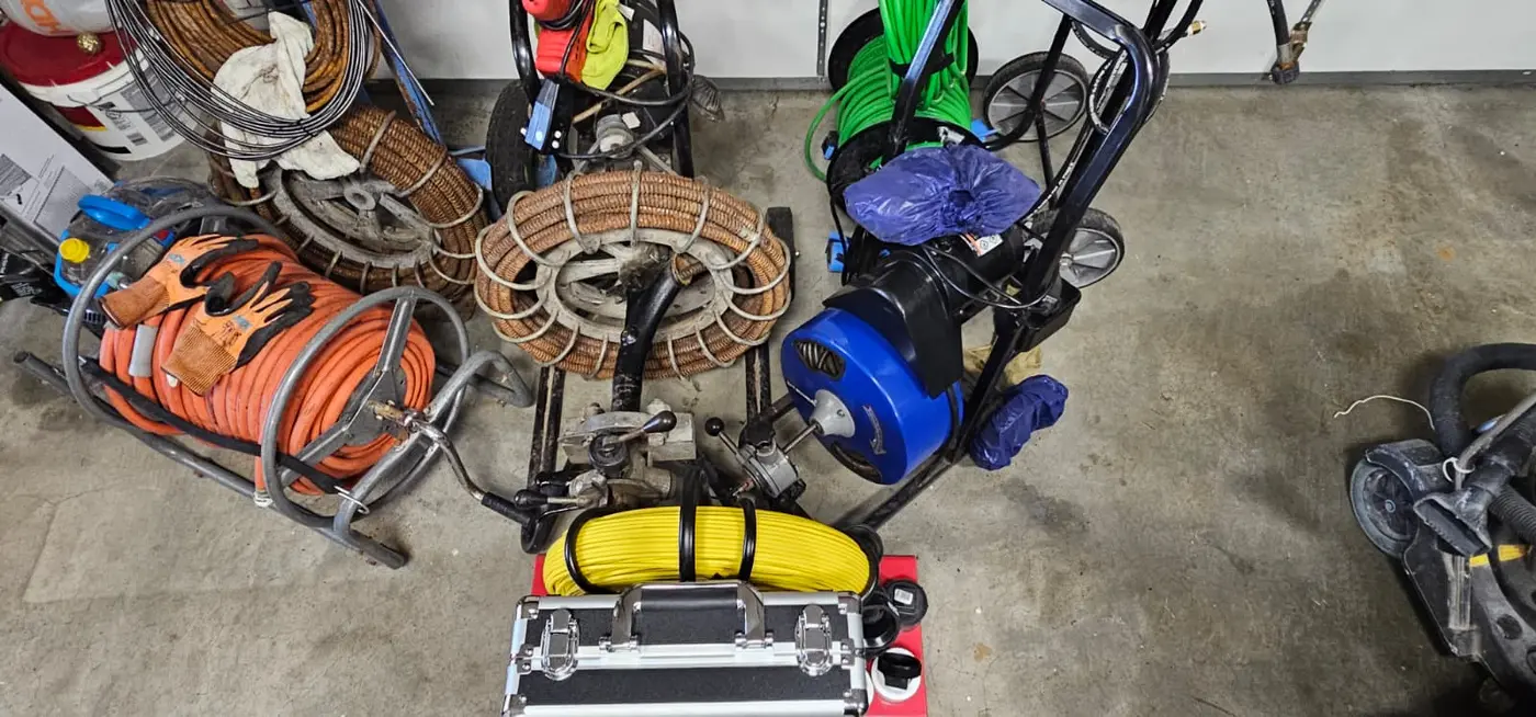 Drain cleaning, jetting, and sewer camera equipment arranged for service